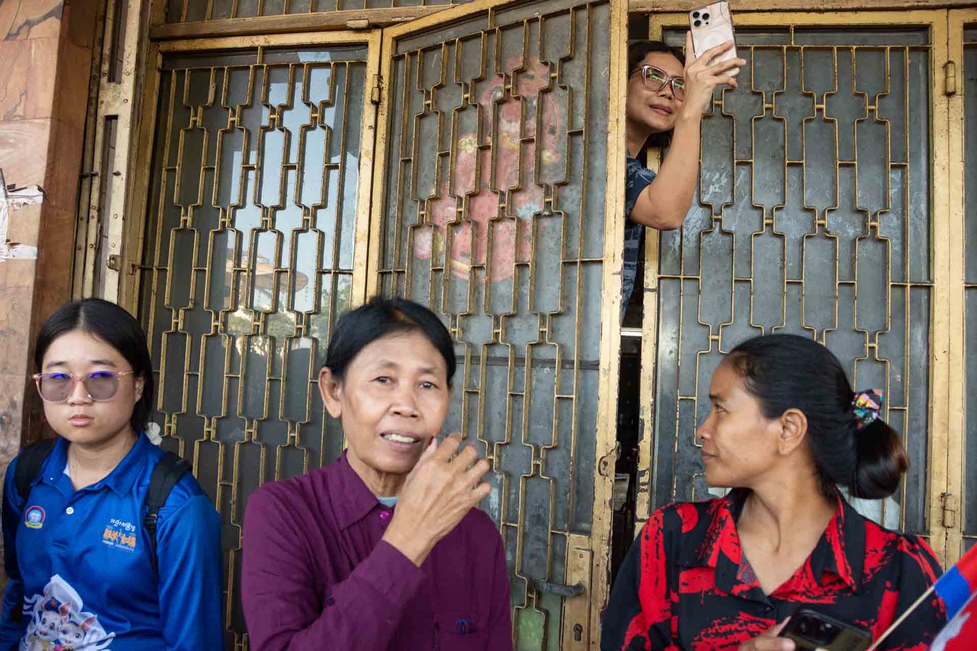 A woman takes a phone photo of the March for Peace. The rally saw an estimated 30 thousand protesters march from Sisowath Quay on the riverside to Independence Monument in Phnom Penh, Cambodia.